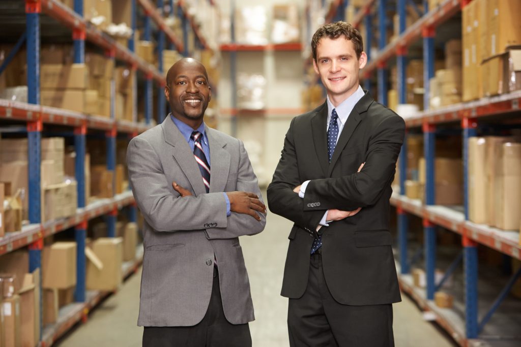 portrait,of,two,businessmen,in,warehouse